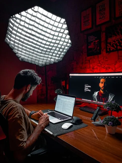 A contemporary workspace showcasing a laptop, tablet, and smartphones, ideal for tech and freelance use.